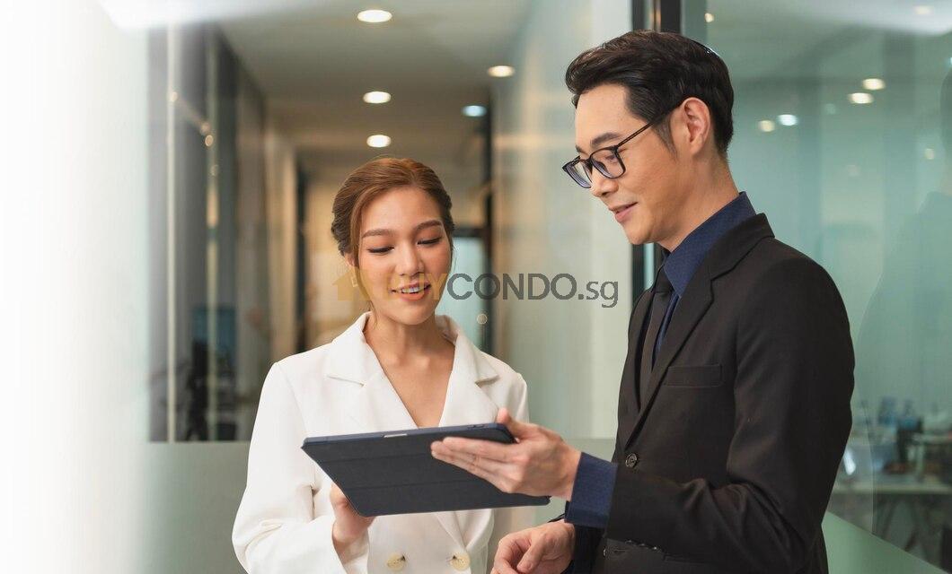 smiling asian businesswoman showing tablet her manager during meeting office 74952 2767